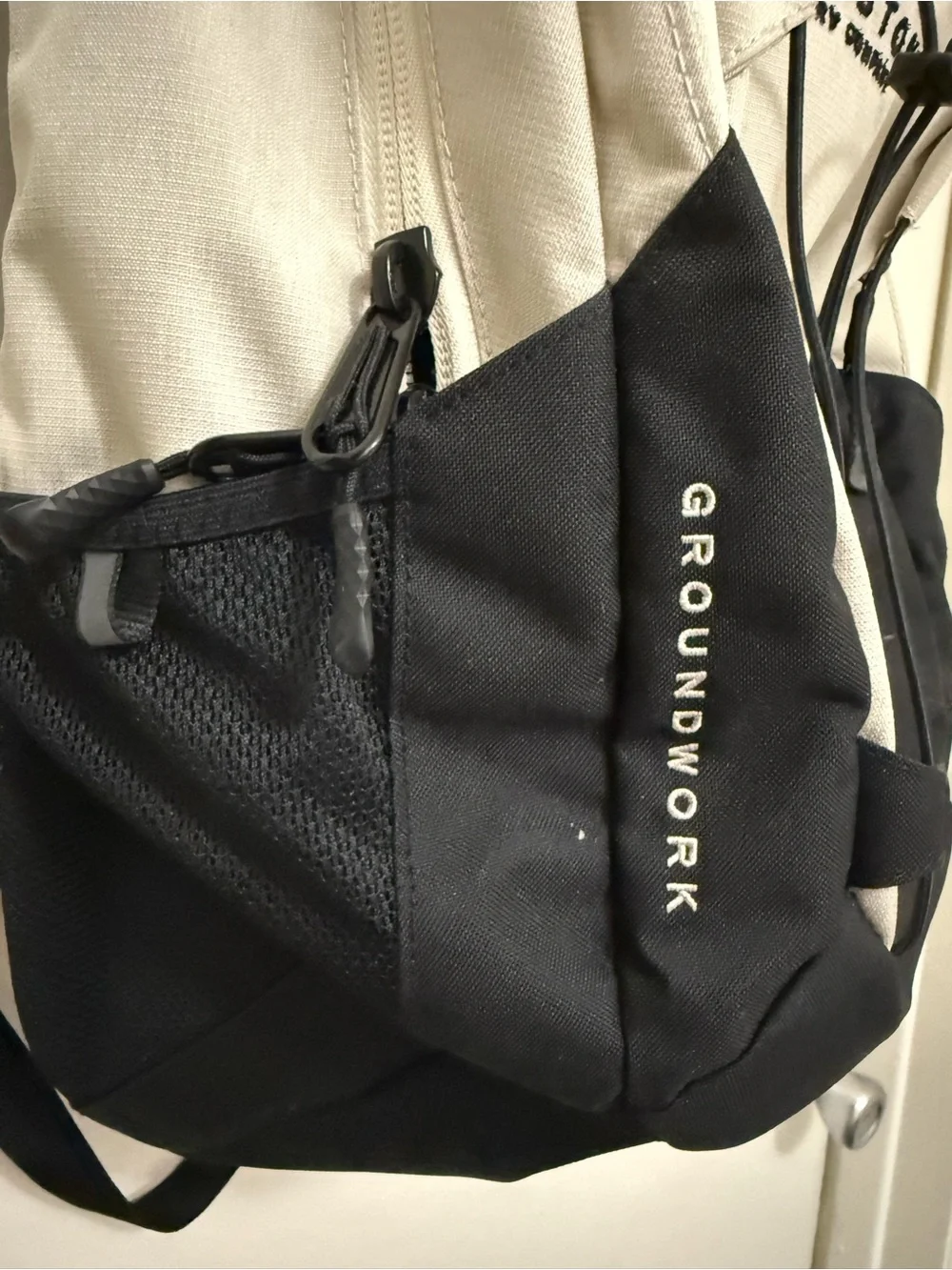 The North Face Two-Tone Beige and Black Backpack with Bungee Front